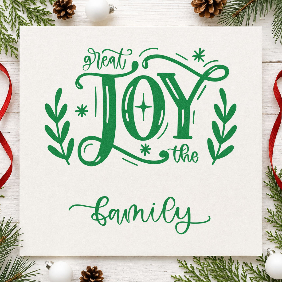 Great Joy To The Family craft stamp imprint in green ink on a handmade project, one idea being reunion dinner programs.
