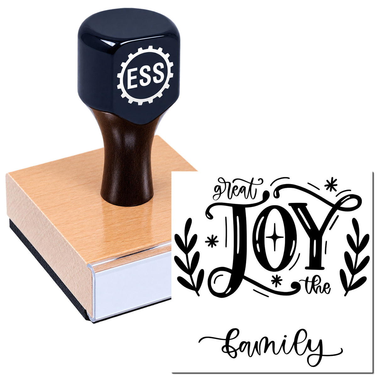 Black rubber stamp and seal on a wooden block, with decorative "great JOY the family" design in black and white.