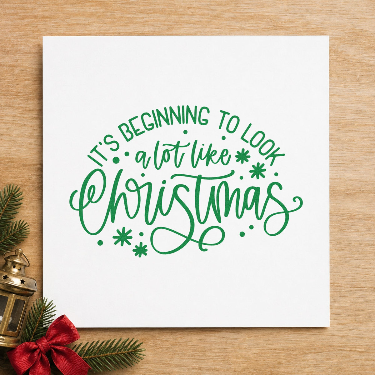 Beginning To Look Like Christmas craft stamp imprint in green ink on a handmade project, one idea being ornament hook tags.