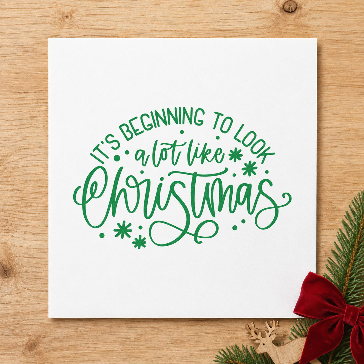 Beginning To Look Like Christmas craft stamp imprint in green ink on a handmade project, one idea being trim party invites.