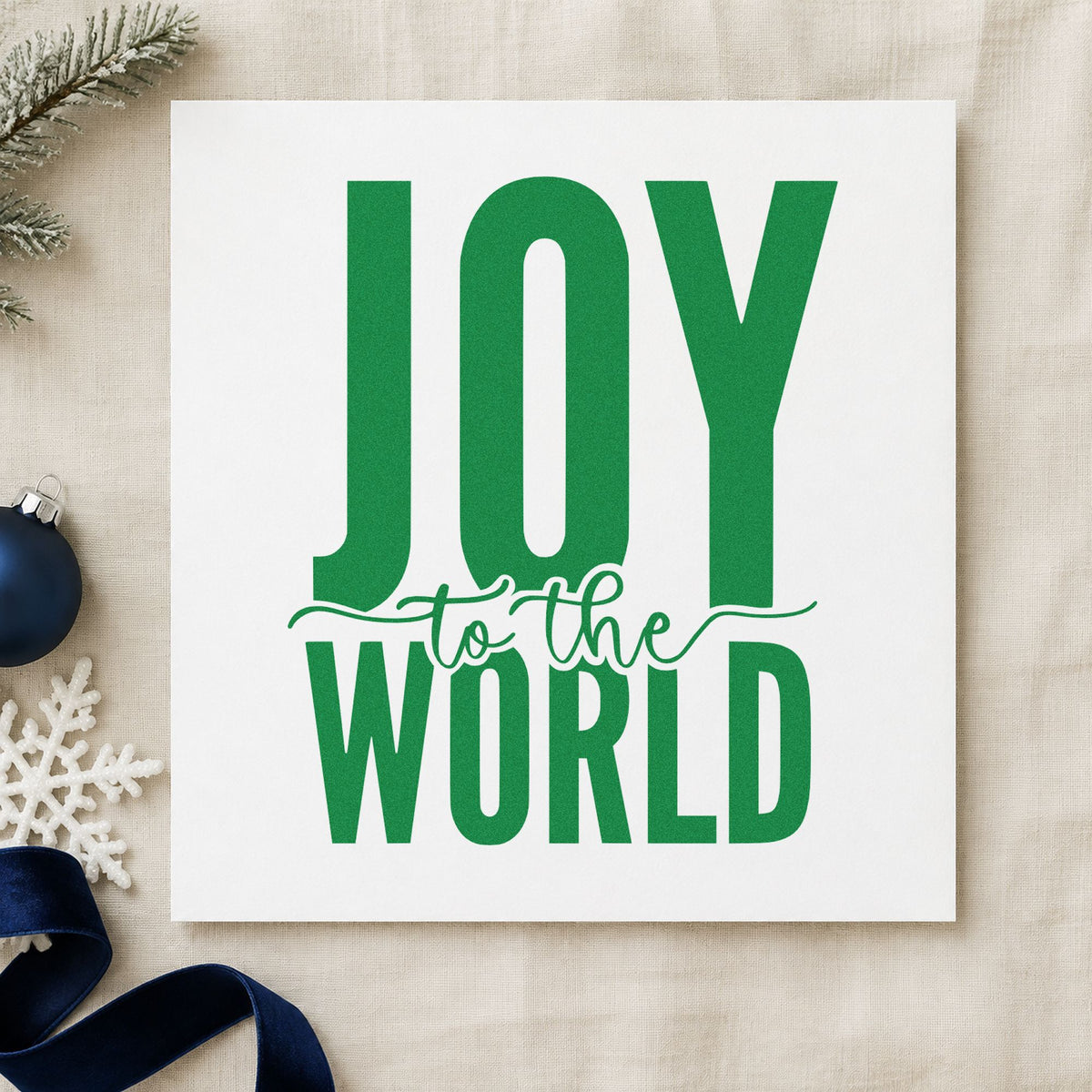 Joy To The World Bold craft stamp imprint in green ink on a handmade project, one idea being big print gift tags.