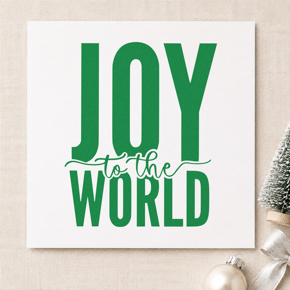 Joy To The World Bold craft stamp imprint in green ink on a handmade project, one idea being stage backdrop signs.