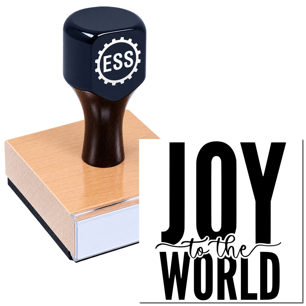 Black ESS logo hand stamp on wooden seal block beside bold "JOY to the WORLD" lettering.