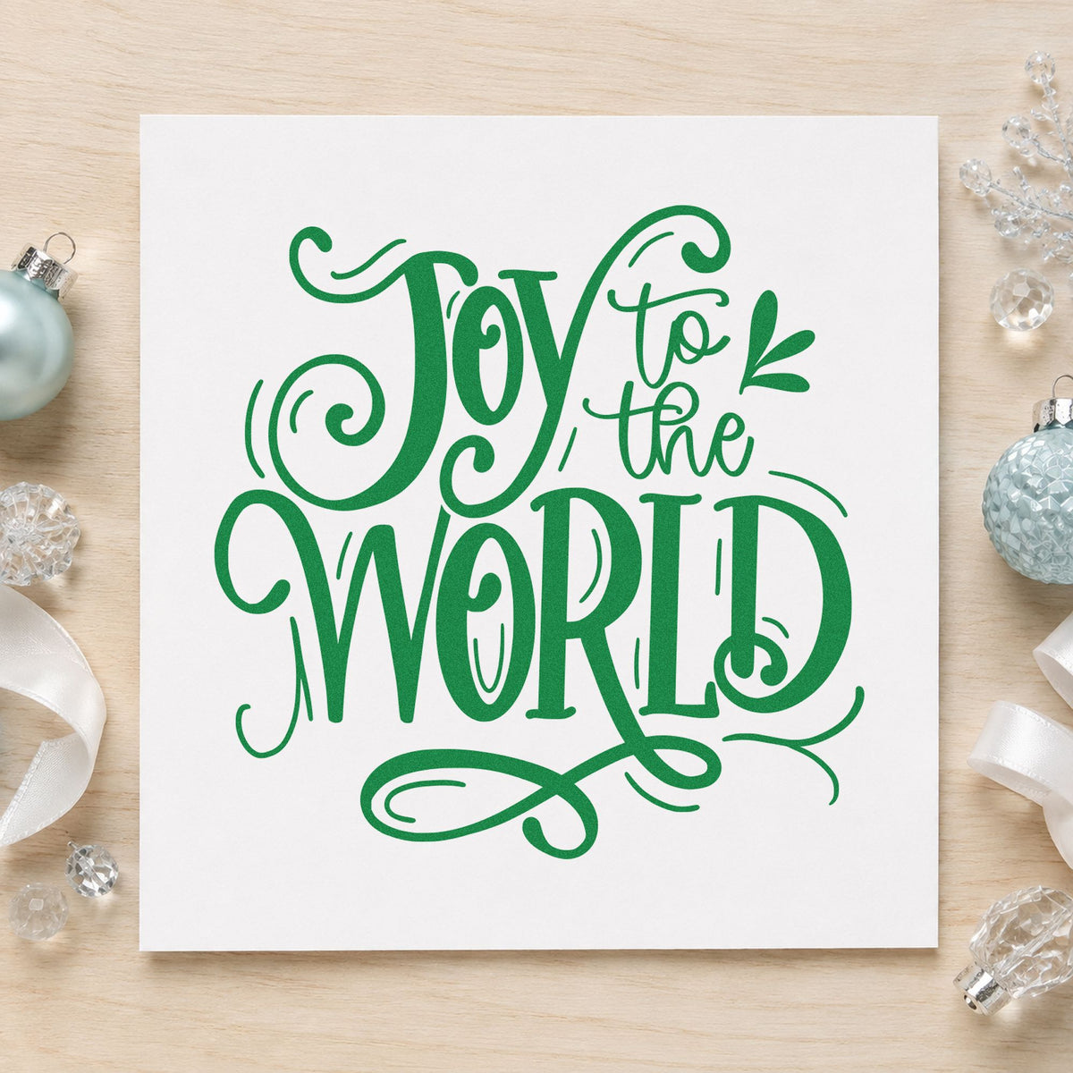 Joy To The World Ornate craft stamp imprint in green ink on a handmade project, one idea being songbook gift tags.