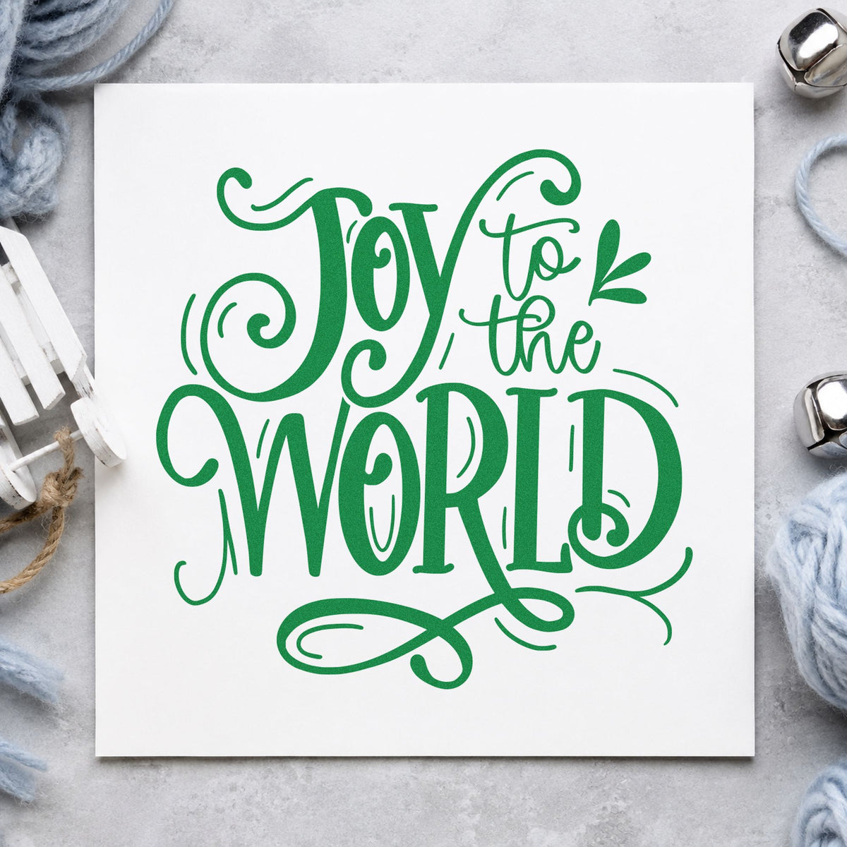 Joy To The World Ornate craft stamp imprinted in green ink on paper, a design suited to framed music library.
