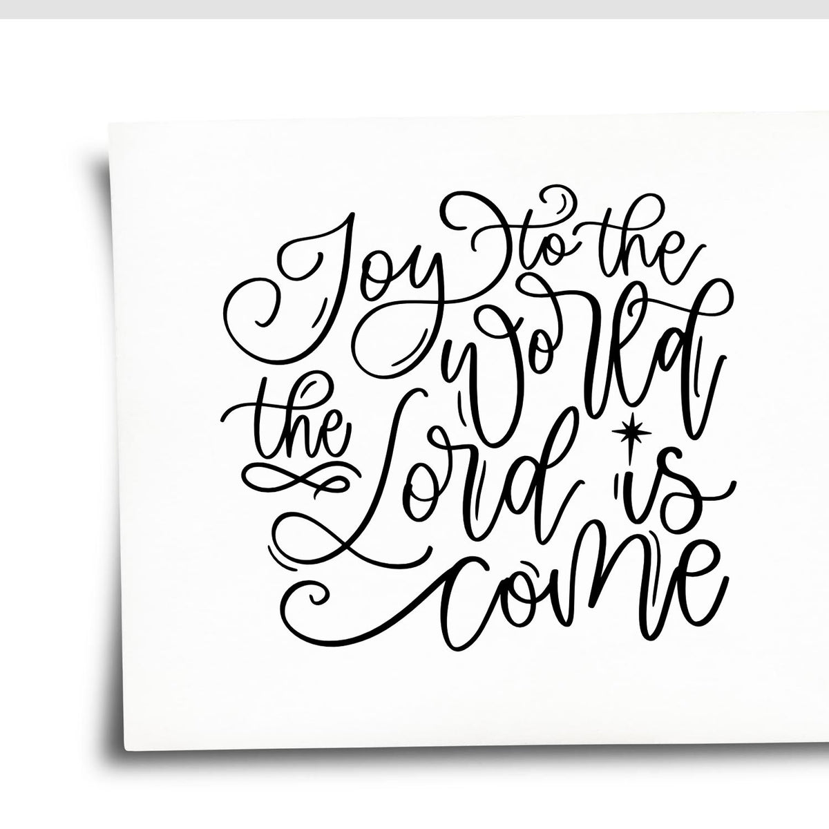 Black calligraphy stamp and seal design on white paper, reading Joy to the World, the Lord Is Come.