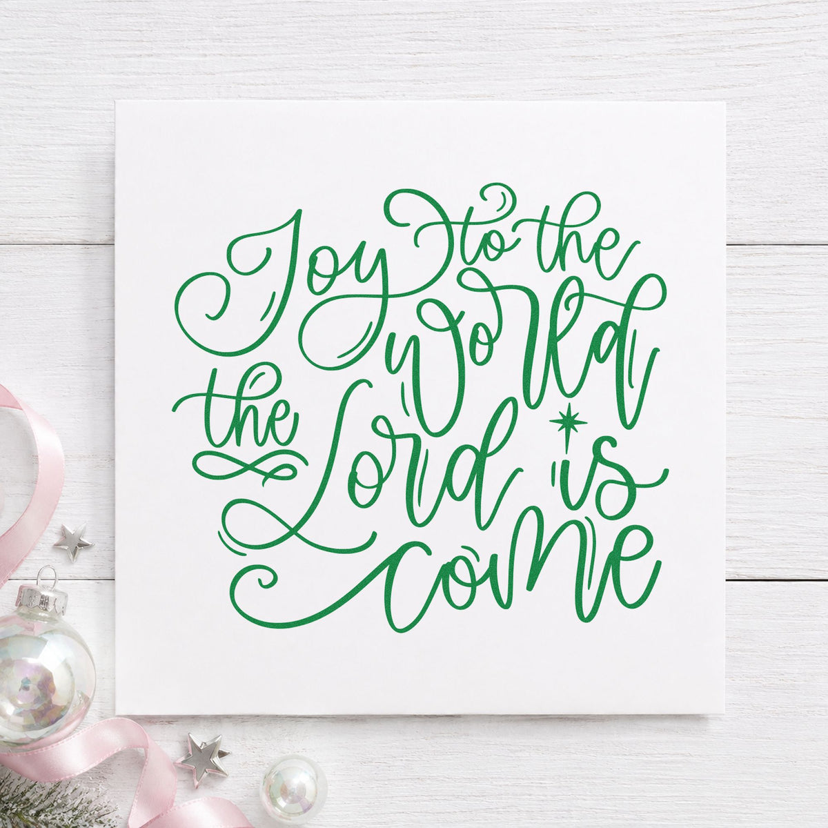 Joy World Lord Is Come craft stamp imprint in green ink on a handmade project, one idea being keepsake book tags.