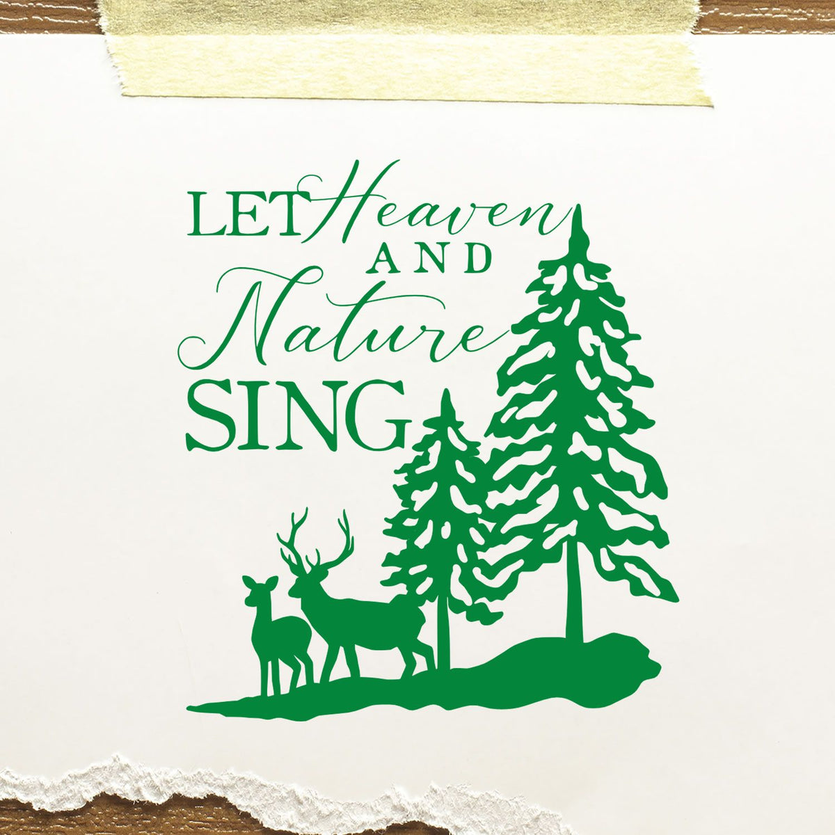 Green holiday stamp seal with Let Heaven and Nature Sing text, pine trees, and deer silhouette.
