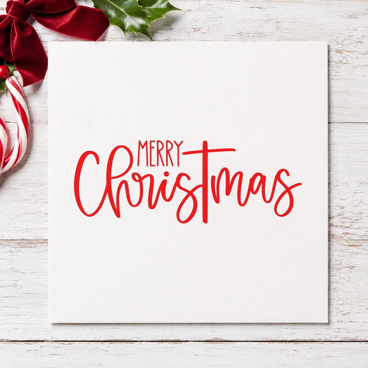 Merry Christmas Narrow Script craft stamp in red ink on cardstock, an easy option for tea towel stripe ink.