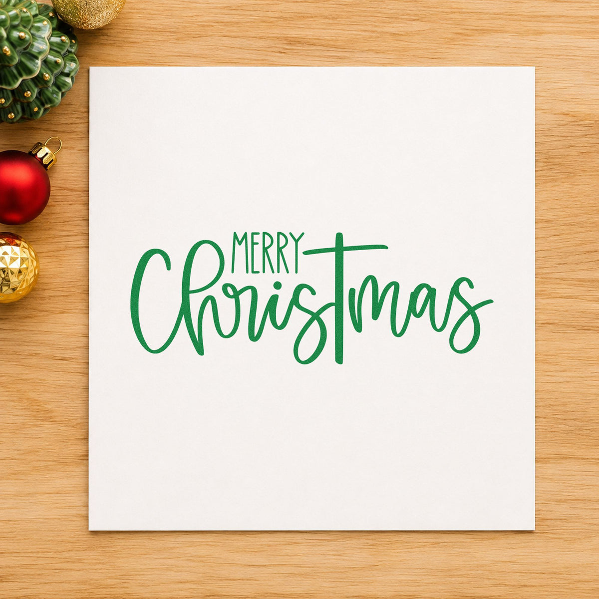 Merry Christmas Narrow Script craft stamp imprint in green ink on a handmade project, one idea being door hanger signs.