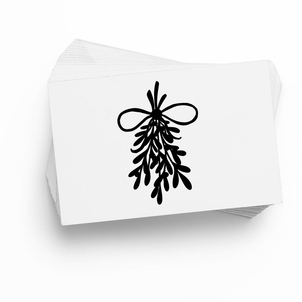 Stack of white stamp and seal cards with a black hanging botanical ribbon seal