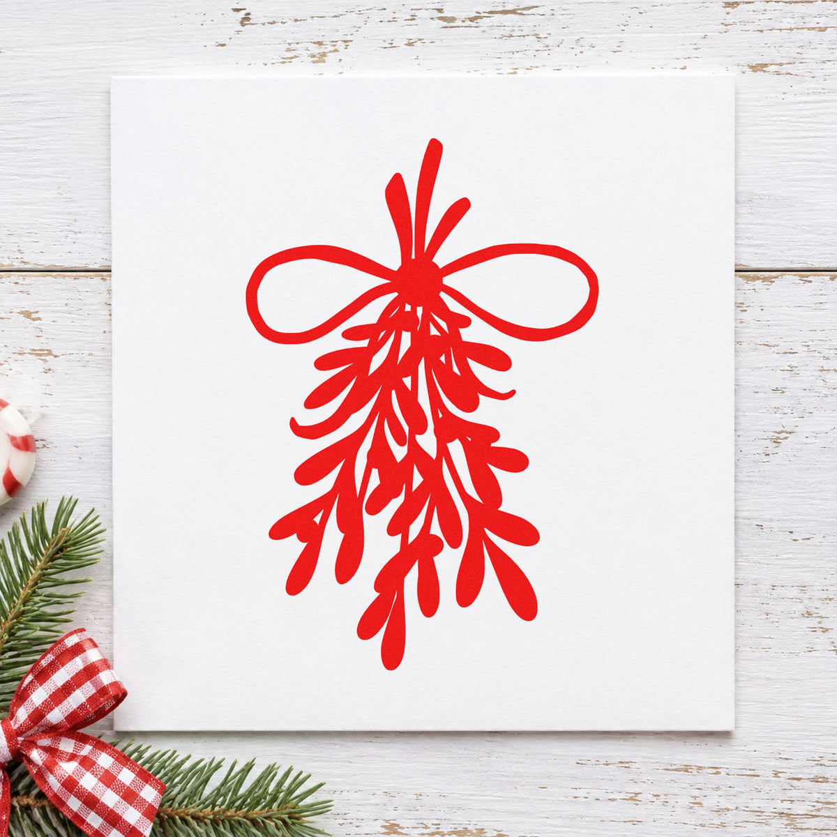 Mistletoe Bundle With Bow rubber stamp shown in red ink, stamped for projects such as soap wrapper seals.