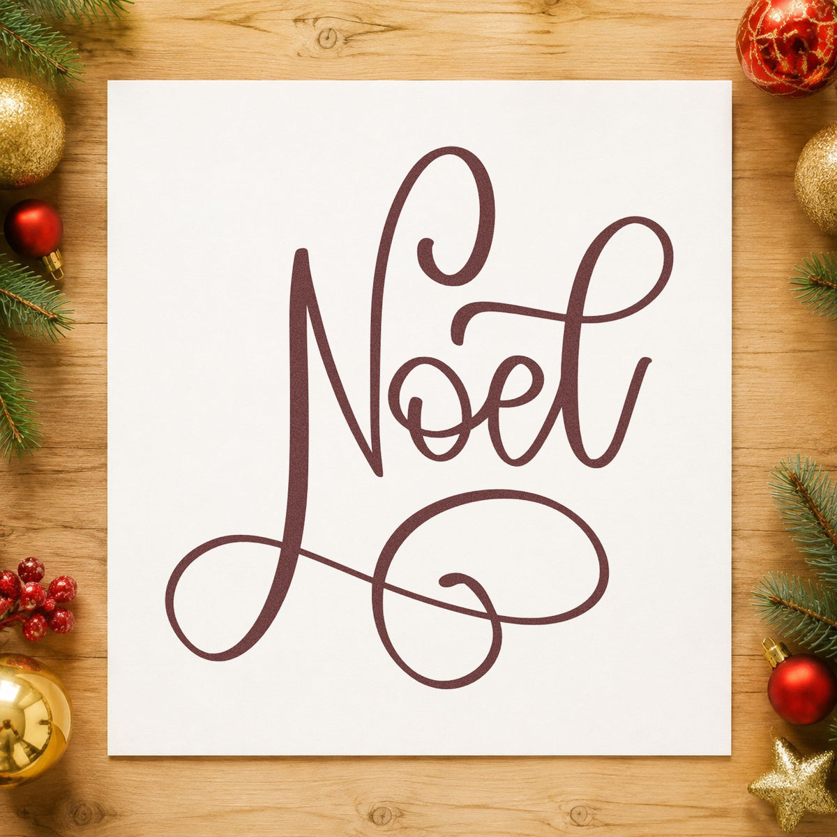 Noel Flowing Script rubber stamp printed in brown ink, ready for chapter break page and similar paper crafts.