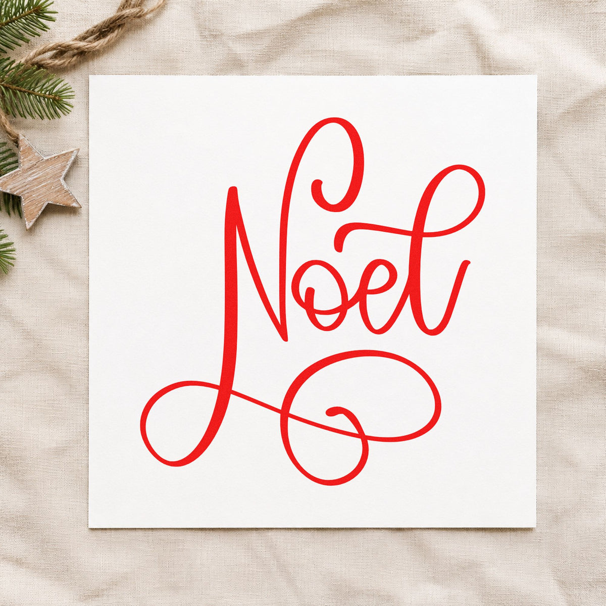 Noel Flowing Script rubber stamp shown in red ink, stamped for projects such as candle sleeve labels.