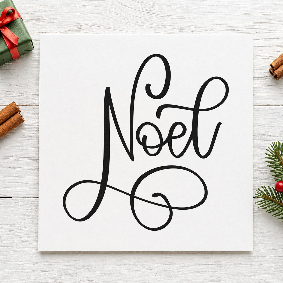 Noel Flowing Script rubber stamp printed in black ink, ready for noel script cards and similar paper crafts.