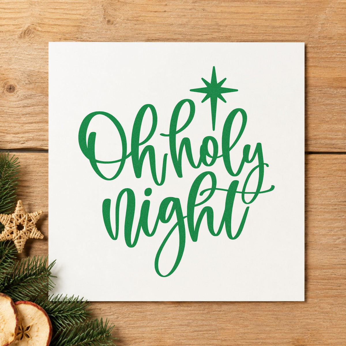 Oh Holy Night Star craft stamp imprint in green ink on a handmade project, one idea being sheet music tags.
