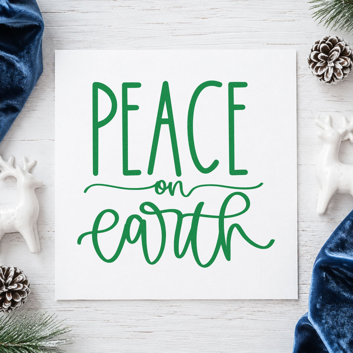 Peace On Earth Script craft stamp imprint in green ink on a handmade project, one idea being wellness gift tags.