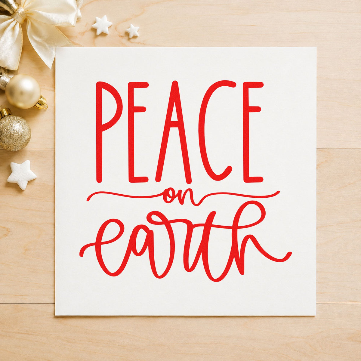 Peace On Earth Script rubber stamp shown in red ink, stamped for projects such as oil bottle labels.