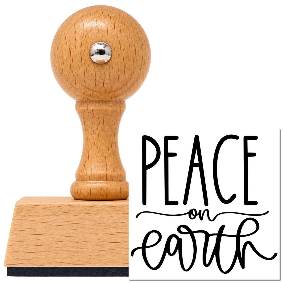 Vintage Pro beech wood stamp with a round knob handle, shown with its black Peace On Earth Script imprint on white.
