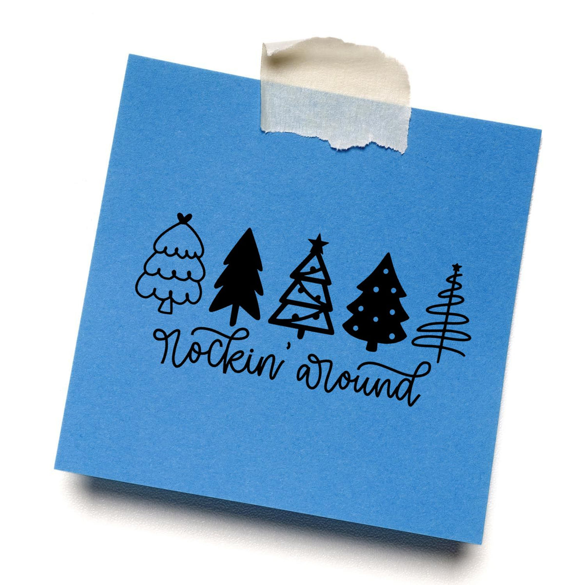 Blue paper note with black holiday tree stamp and seal designs and rockin around script, taped at top.