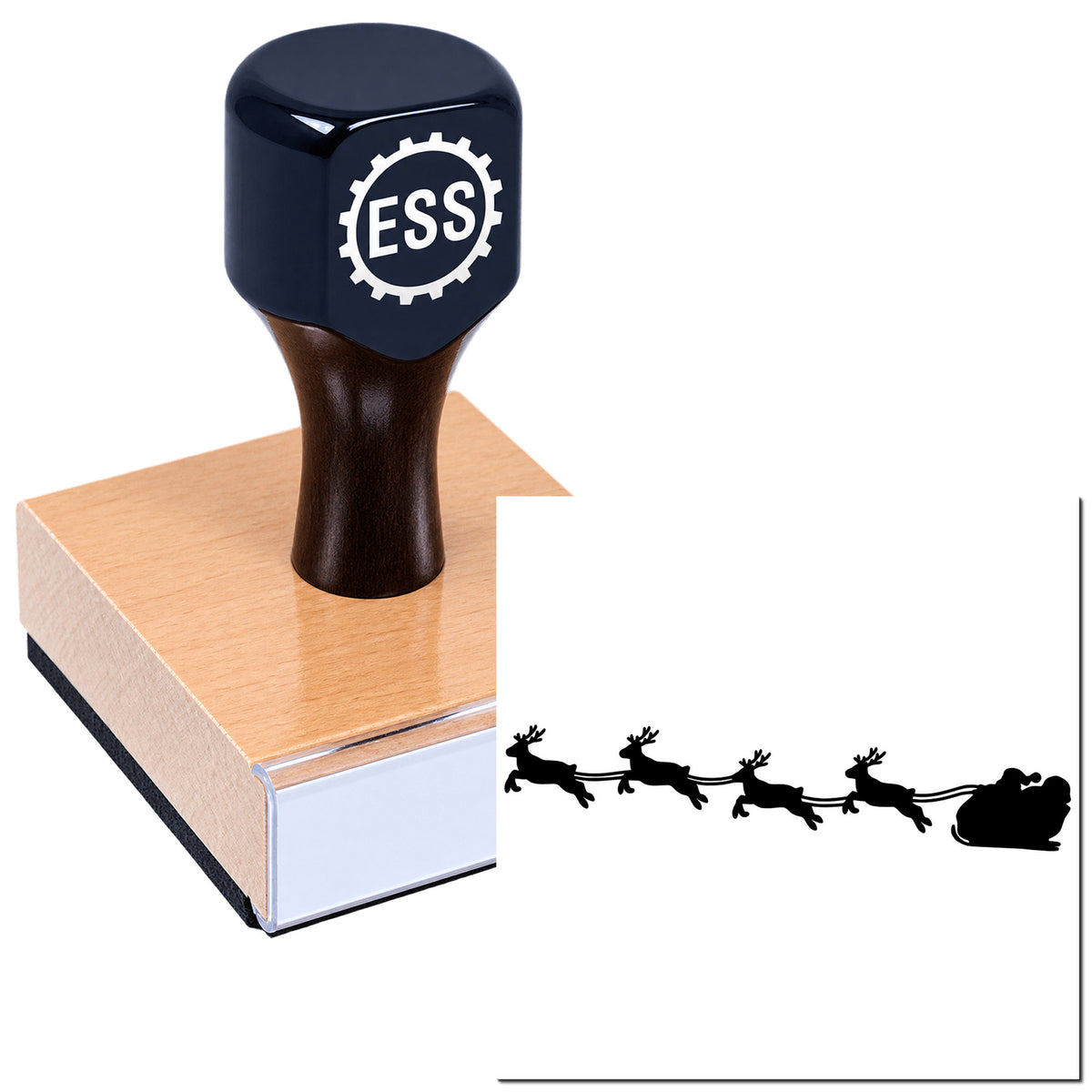 Dark navy ESS rubber stamp on a tan wooden base, with Santa sleigh and reindeer seal design.
