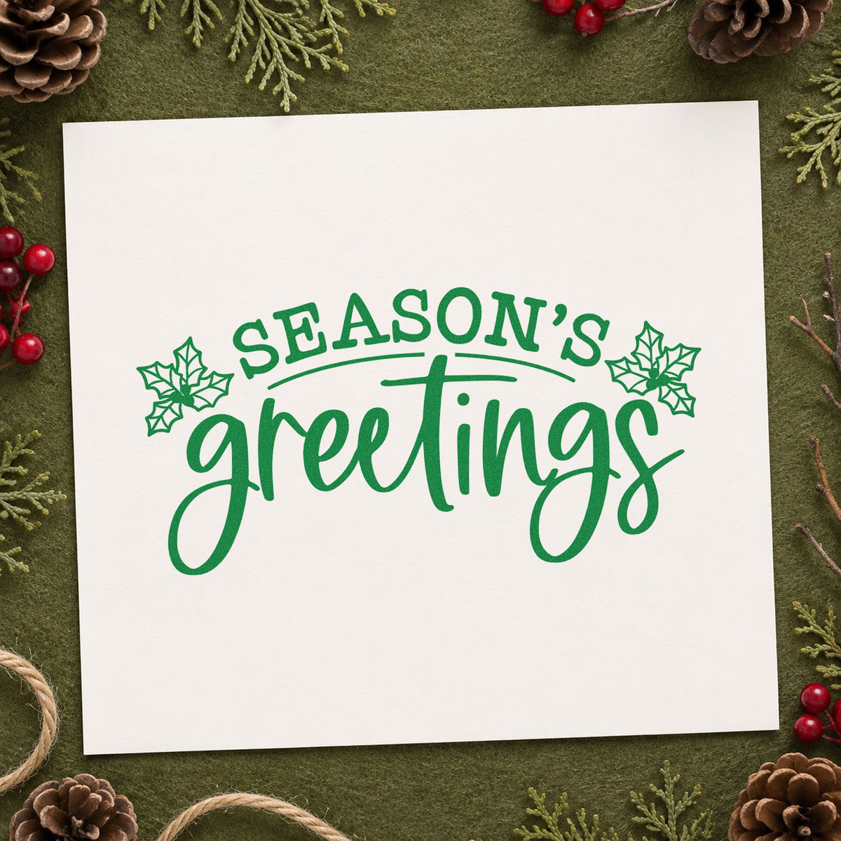 Season's Greetings Holly craft stamp imprint in green ink on a handmade project, one idea being stationery gift tags.
