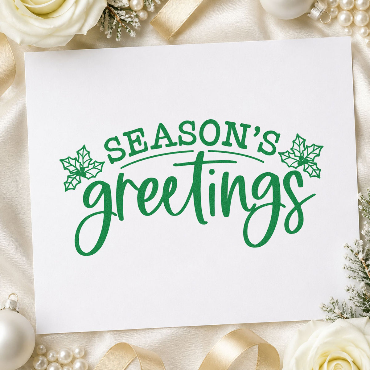 Season's Greetings Holly craft stamp imprinted in green ink on paper, a design suited to framed studio sign.