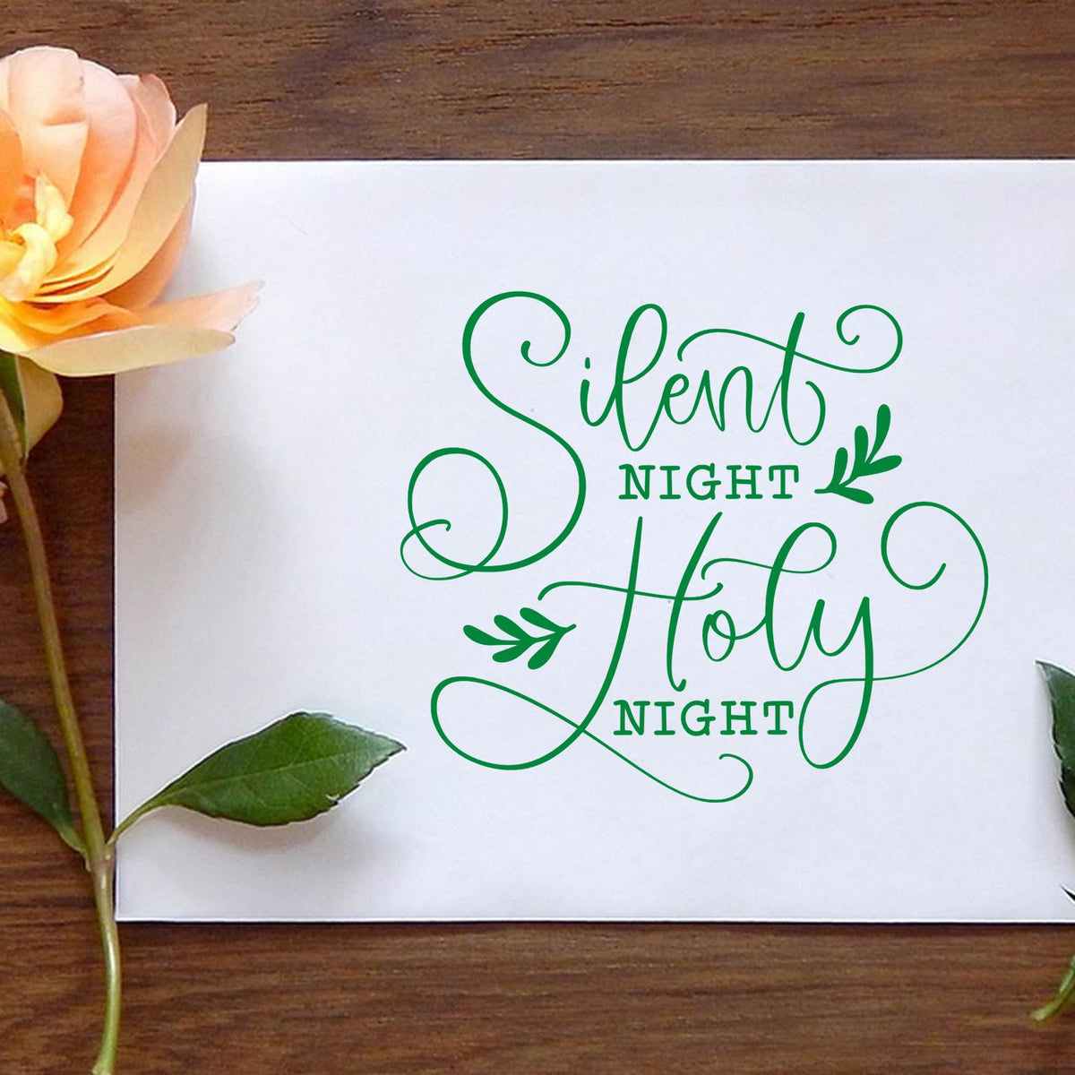 Silent Night Holy Night rubber stamp shown in green ink, stamped for projects such as service album page.