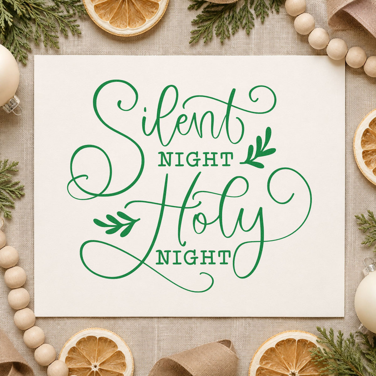 Silent Night Holy Night craft stamp imprint in green ink on a handmade project, one idea being memorial service cards.