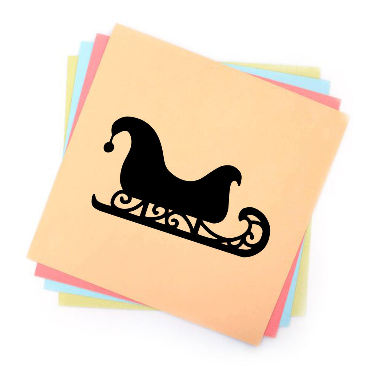Black sleigh stamp on stacked pastel seal sheets in peach, pink, blue, and yellow.
