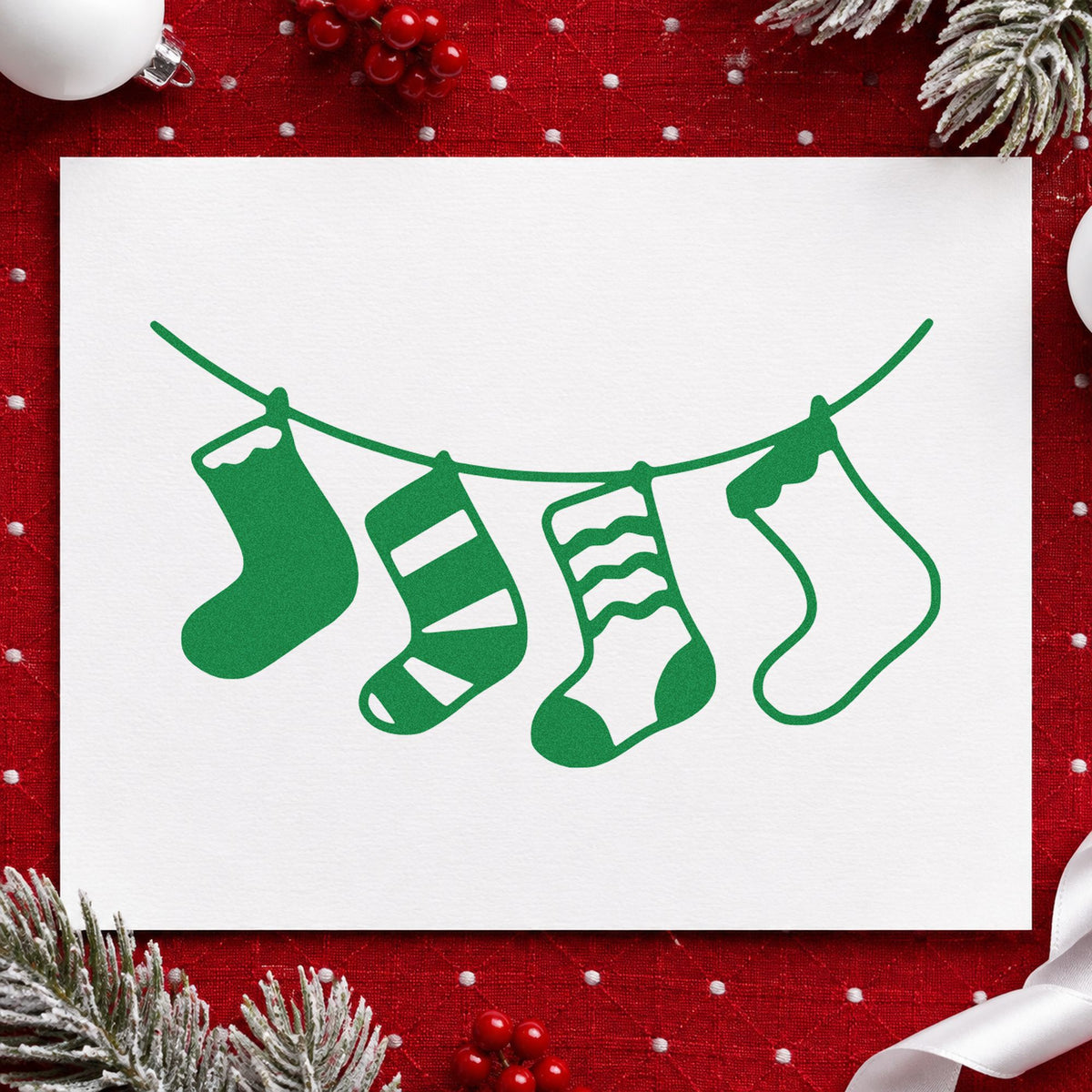 Four Hanging Christmas Stockings craft stamp imprint in green ink on a handmade project, one idea being name write gift tags.