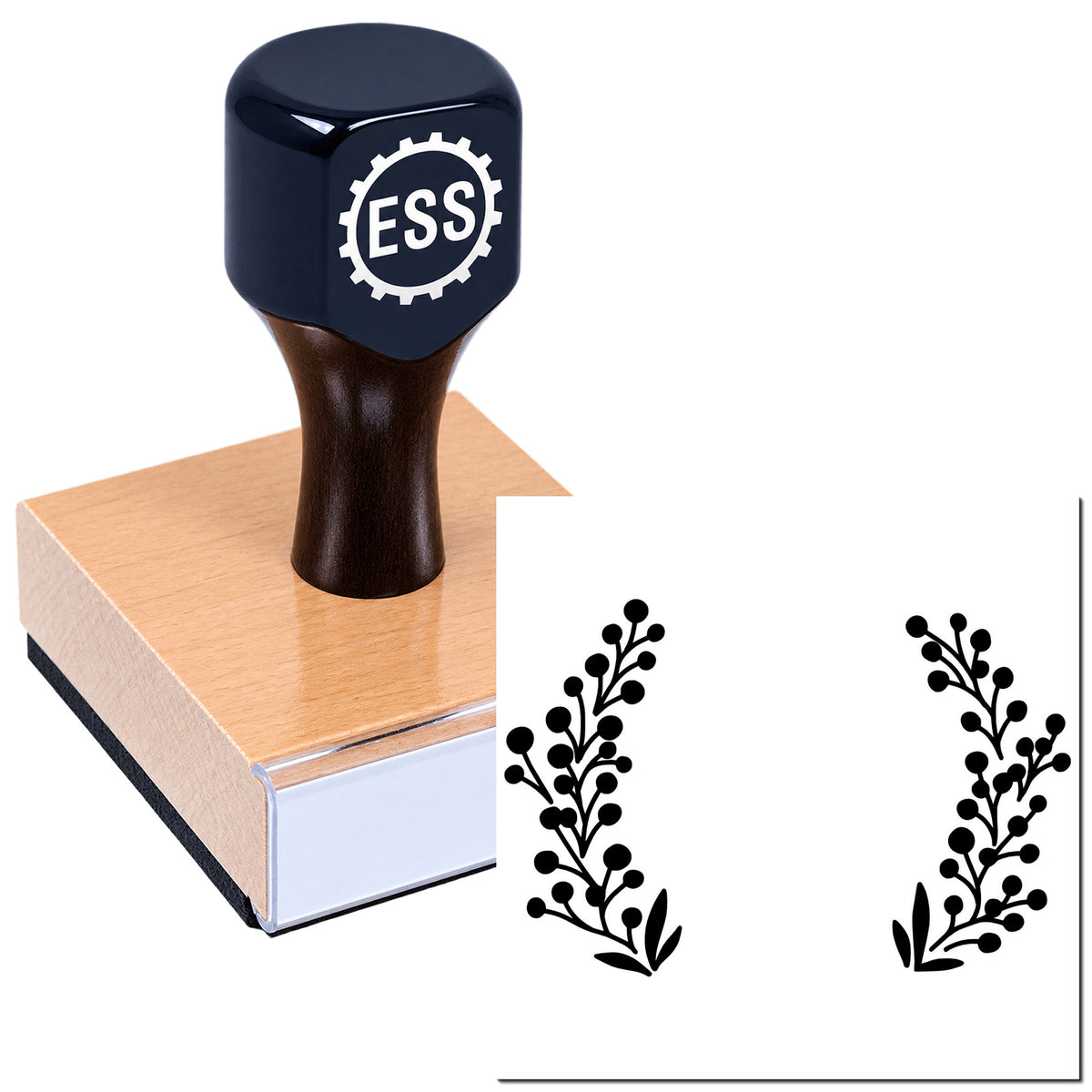 Dark blue ESS stamp on a wooden block with black floral seal designs on a white background.
