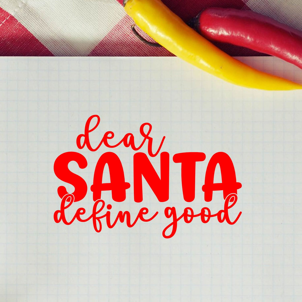 Red Santa stamp reading dear SANTA define good on graph paper, with red and yellow candy canes above.