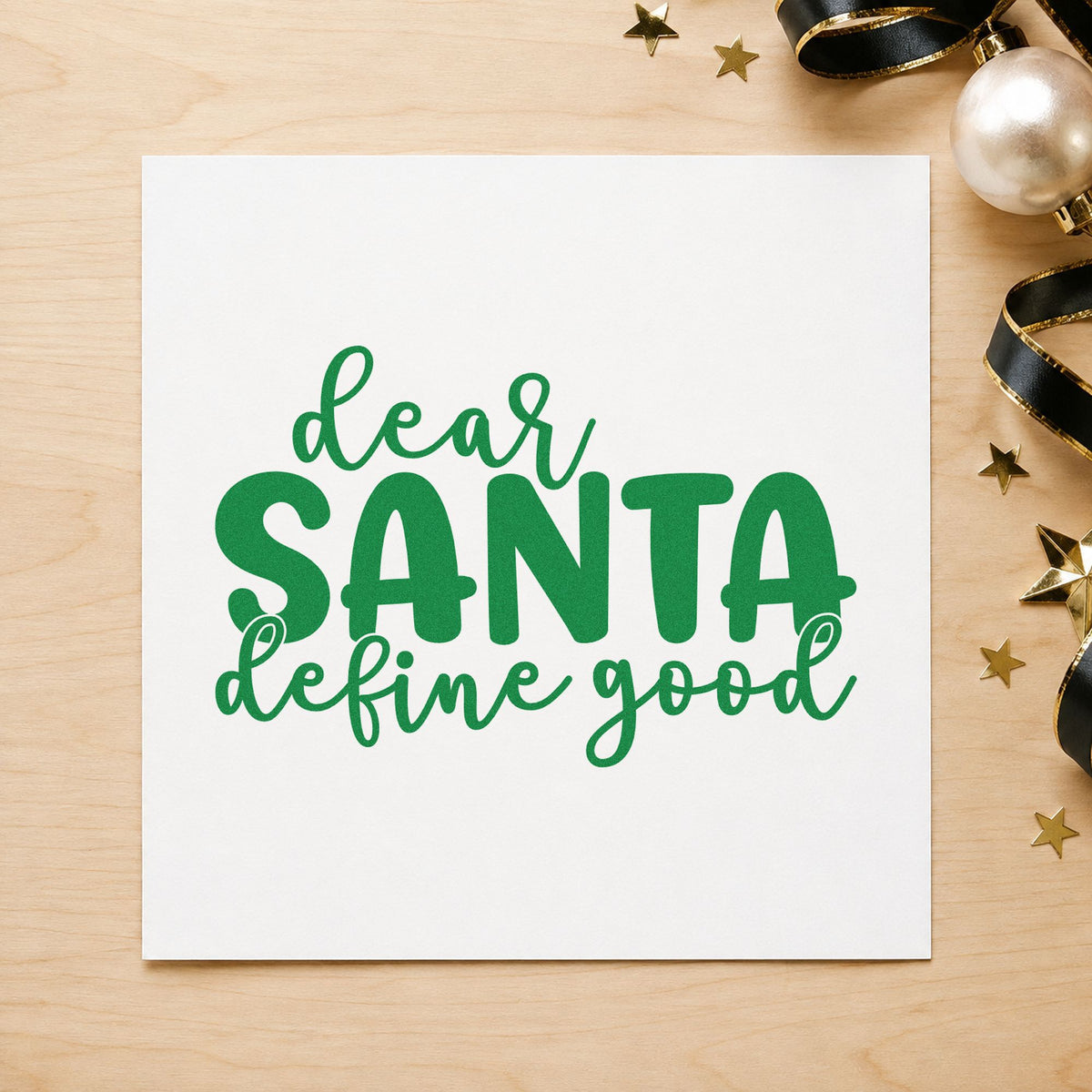 Dear Santa Define Good craft stamp imprint in green ink on a handmade project, one idea being coal joke gift tags.