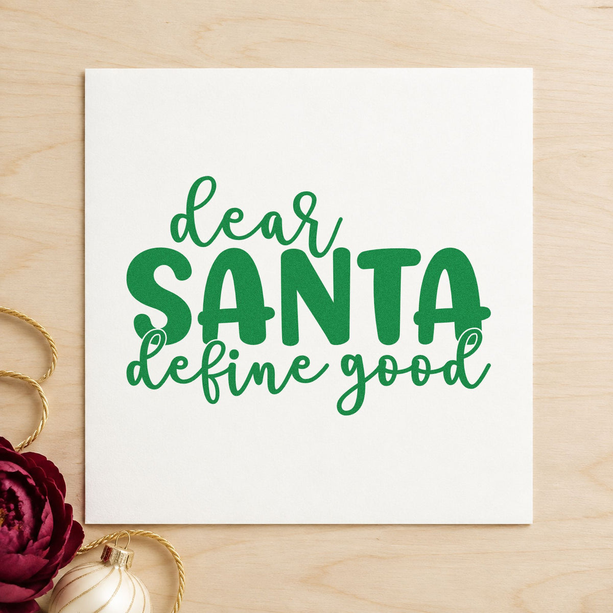 Dear Santa Define Good craft stamp imprint in green ink on a handmade project, one idea being photo prop placards.
