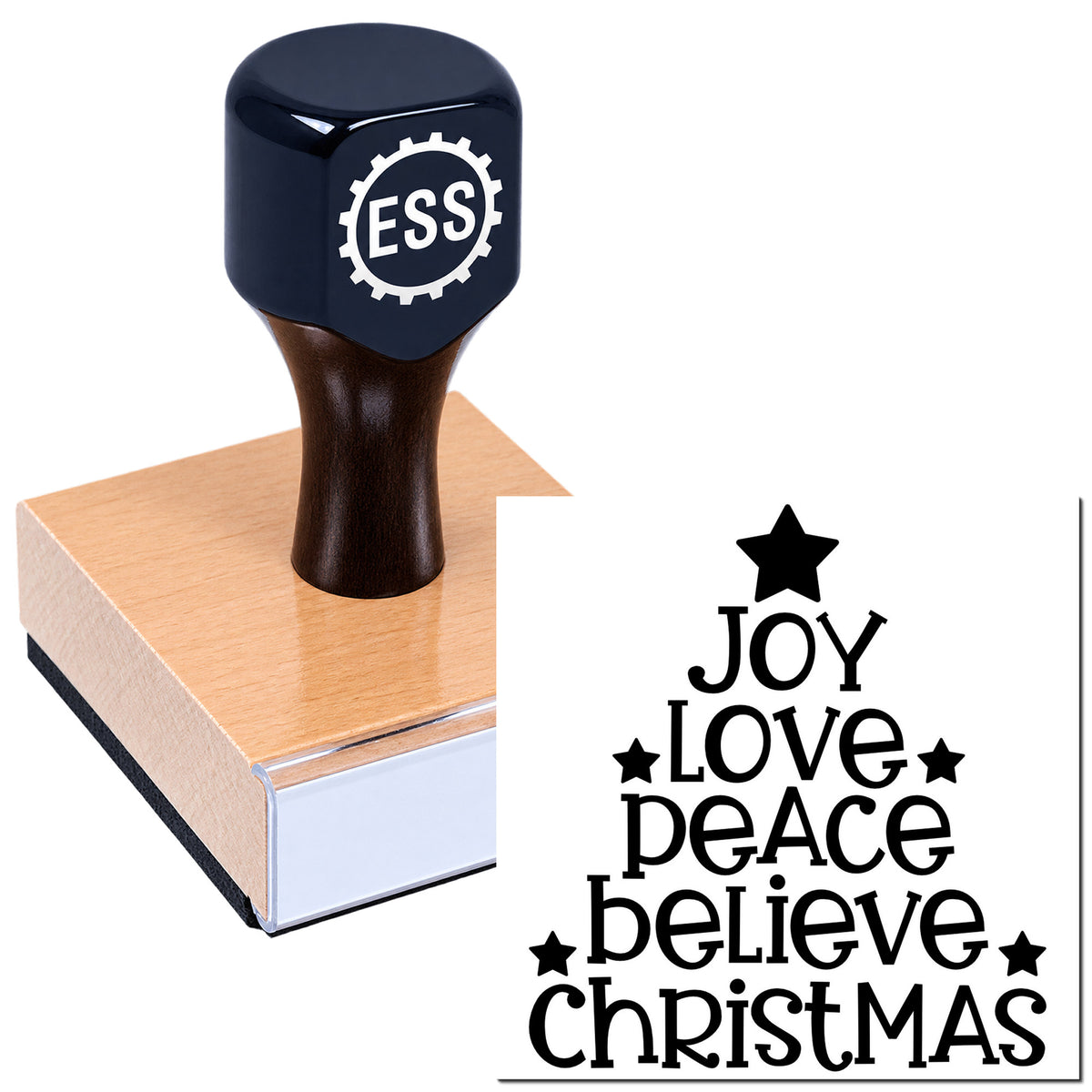 Dark navy ESS wooden rubber stamp and seal with "Joy Love Peace Believe Christmas" and stars on a pink wood block.