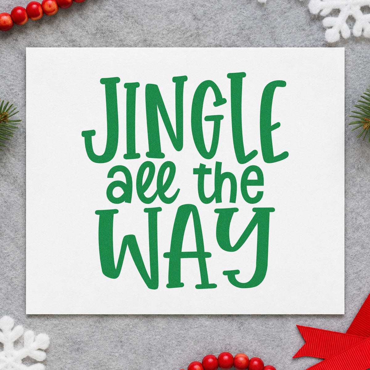 Jingle All The Way craft stamp imprint in green ink on a handmade project, one idea being poster board signs.