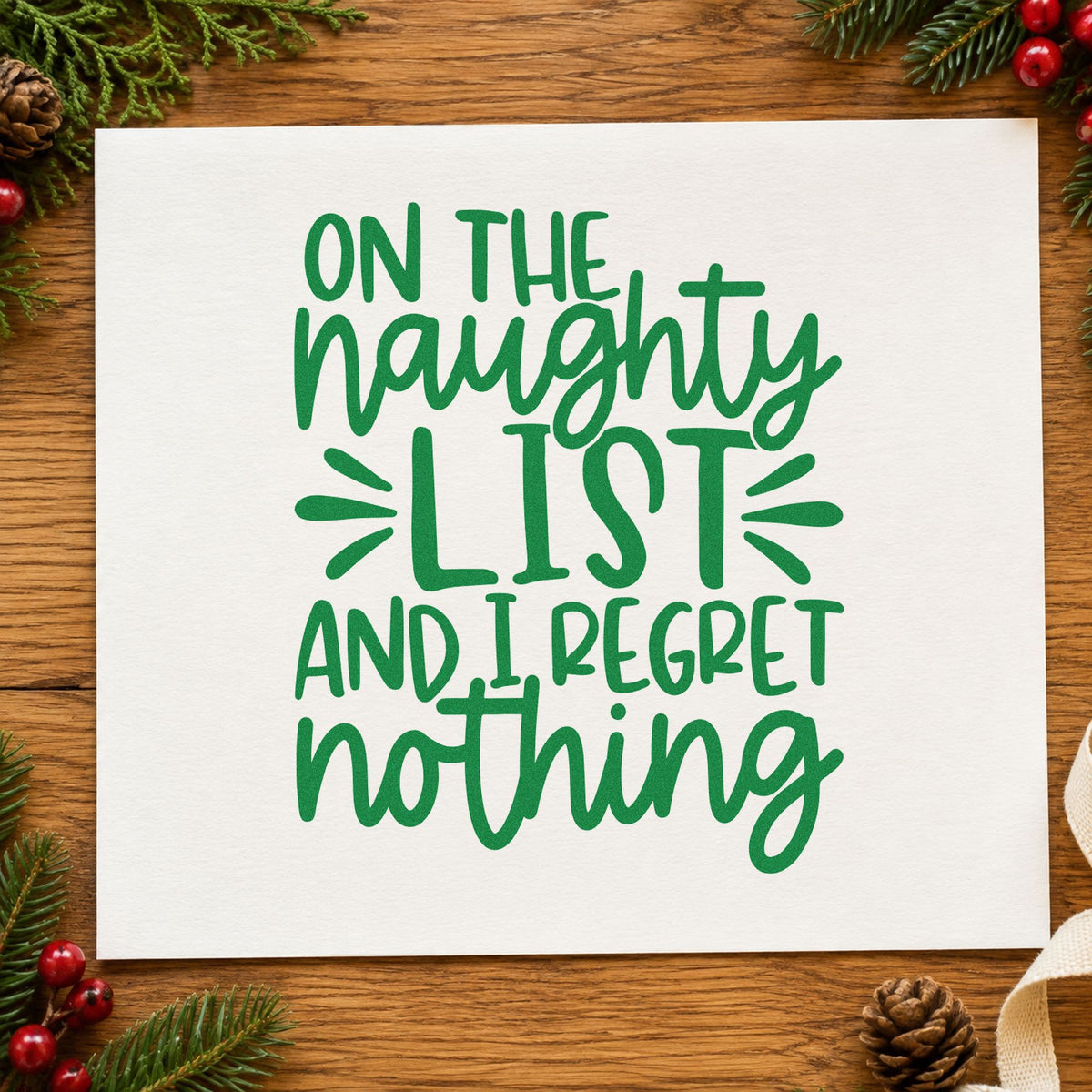 Naughty List Regret Nothing craft stamp imprint in green ink on a handmade project, one idea being white elephant tags.