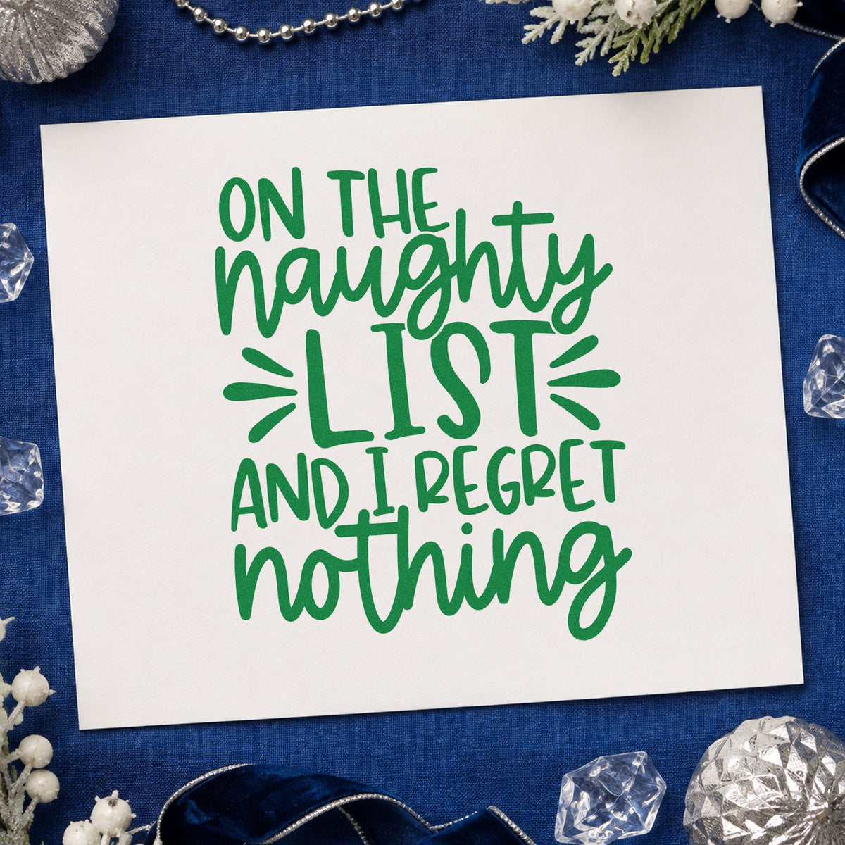 Naughty List Regret Nothing craft stamp imprinted in green ink on paper, a design suited to framed office wall.