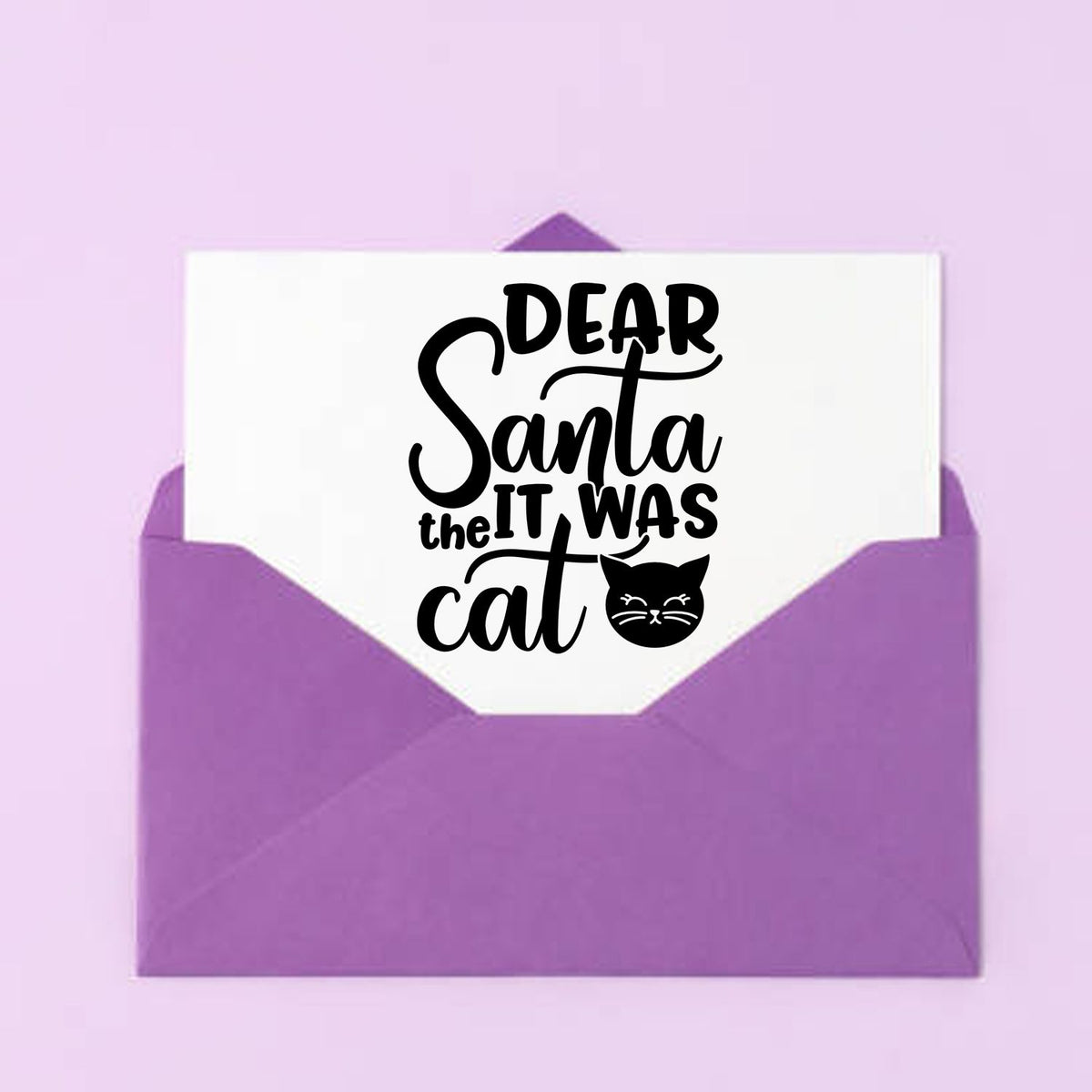 Purple envelope with a white stamp seal reading "Dear Santa, it was the cat" in black, plus a cat icon.