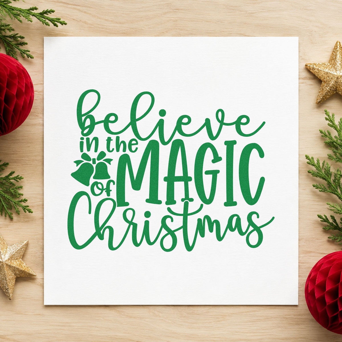 Believe Magic Christmas Holly craft stamp imprinted in green ink on paper, a design suited to framed small ledge.