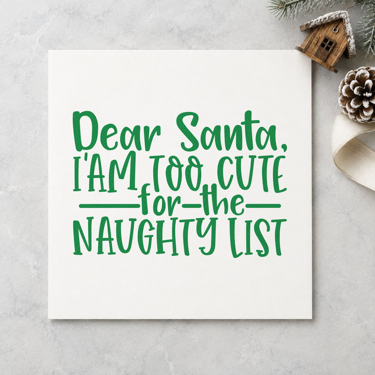 Too Cute For Naughty List craft stamp imprint in green ink on a handmade project, one idea being little one gift tags.