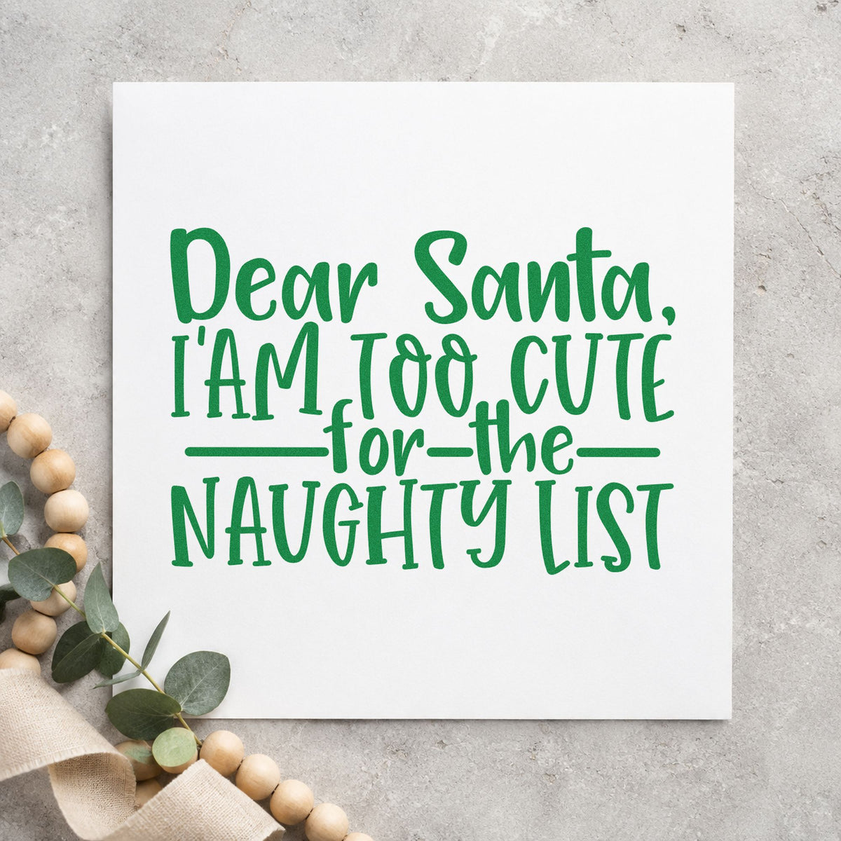Too Cute For Naughty List craft stamp imprint in green ink on a handmade project, one idea being santa visit passes.