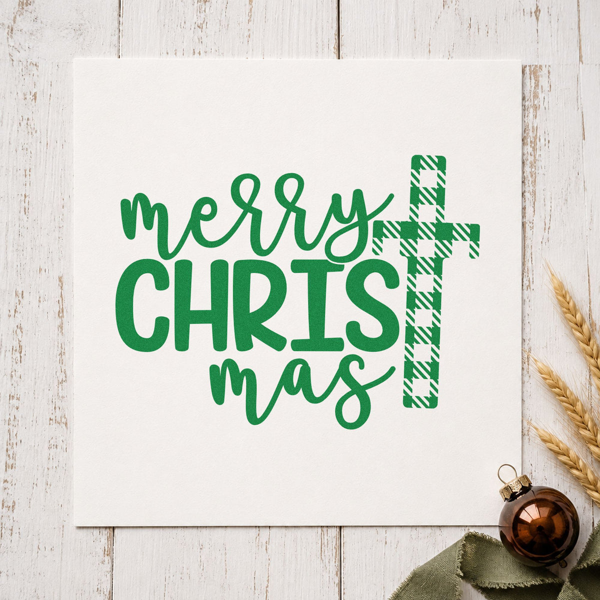 Merry Christmas Plaid Cross craft stamp imprint in green ink on a handmade project, one idea being flannel gift tags.