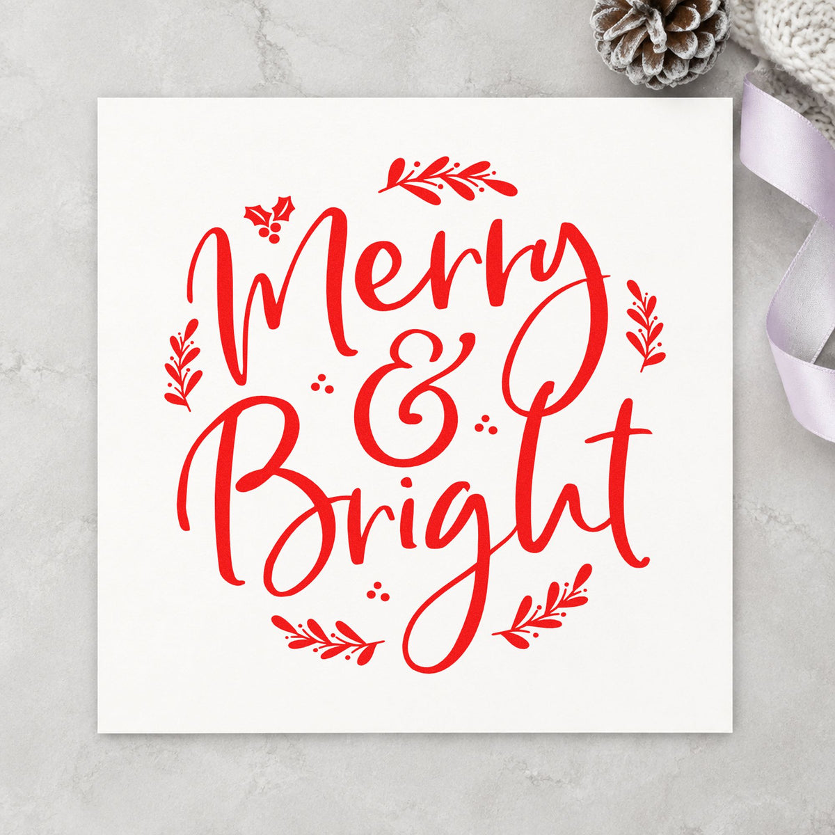 Merry And Bright Botanical craft stamp in red ink on cardstock, an easy option for envelope liner ink.