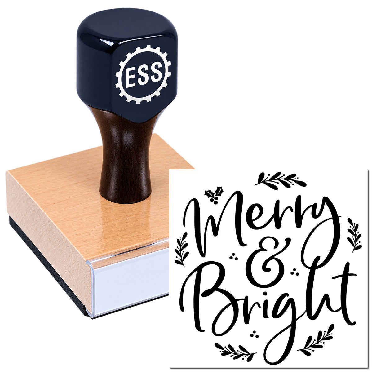 Black ESS rubber stamp on pink wooden seal block, showing festive black "Merry & Bright" script seal.