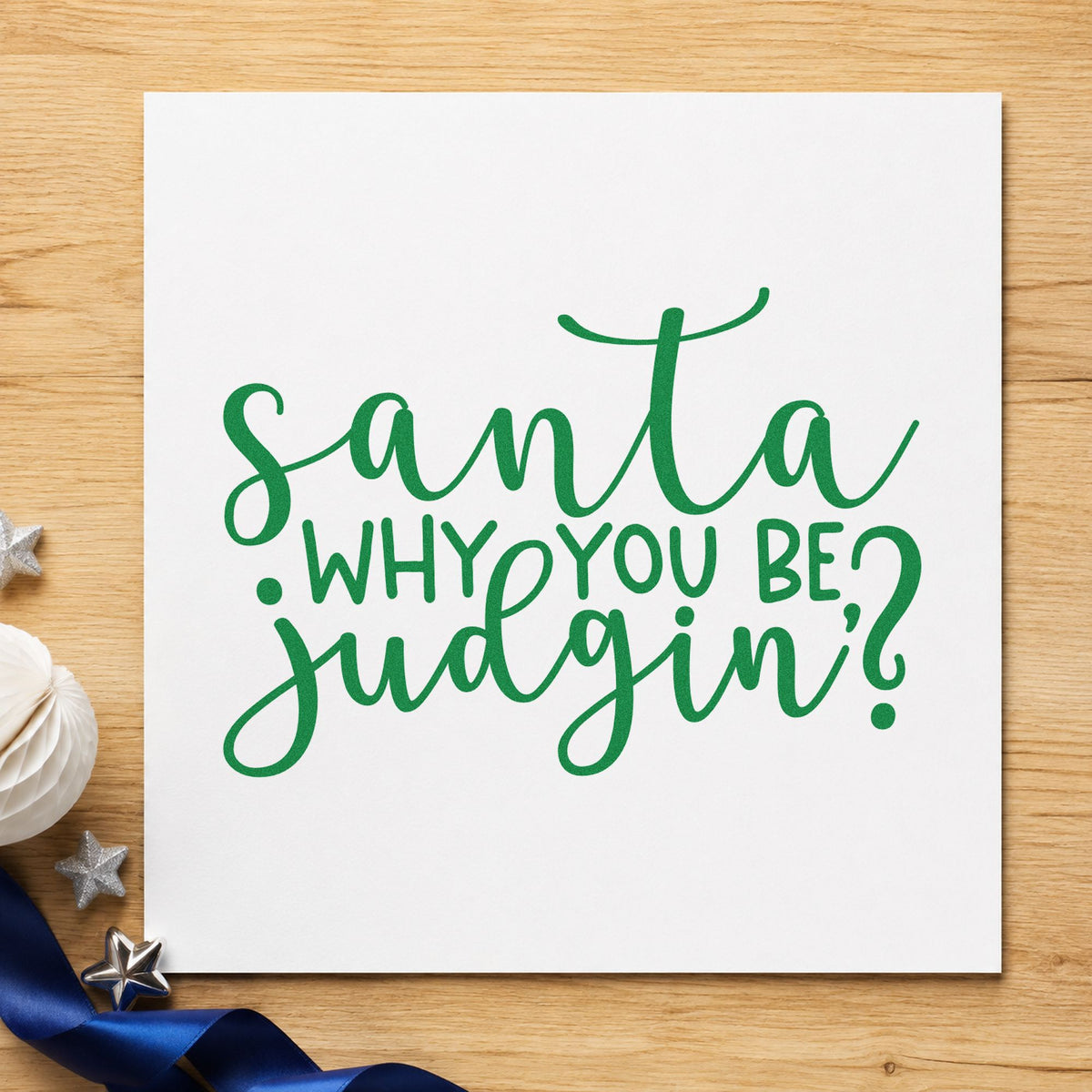 Santa Why You Be Judgin craft stamp imprint in green ink on a handmade project, one idea being sassy gift tags.