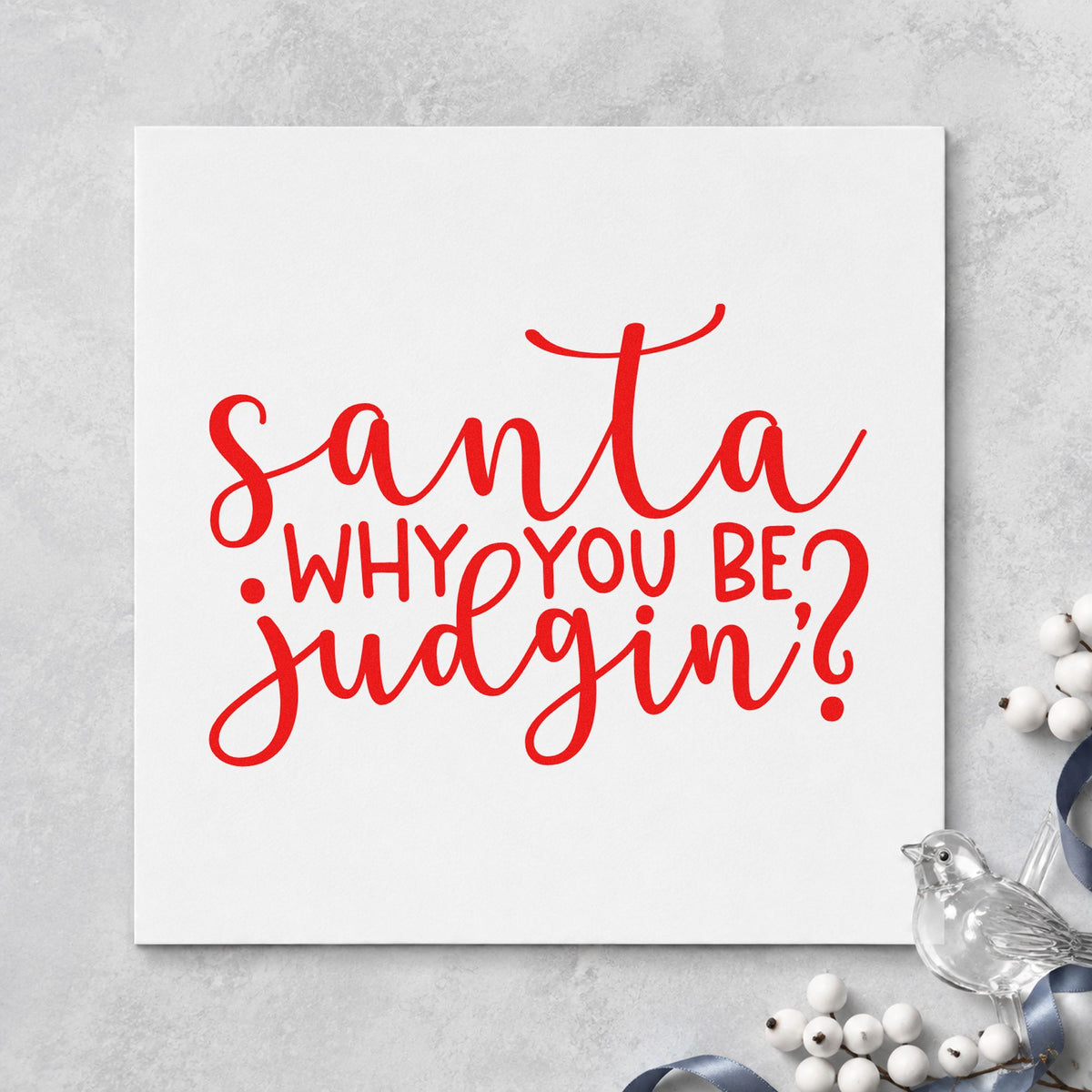 Santa Why You Be Judgin rubber stamp shown in red ink, stamped for projects such as gift bag seals.