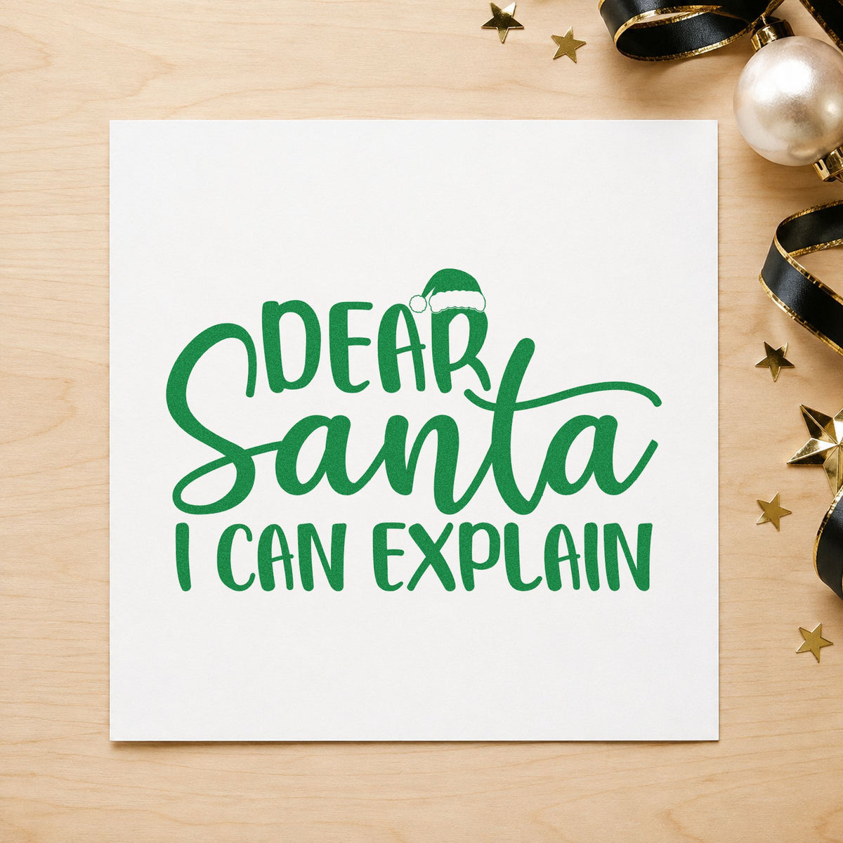 Dear Santa I Can Explain craft stamp imprint in green ink on a handmade project, one idea being dorm gift tags.