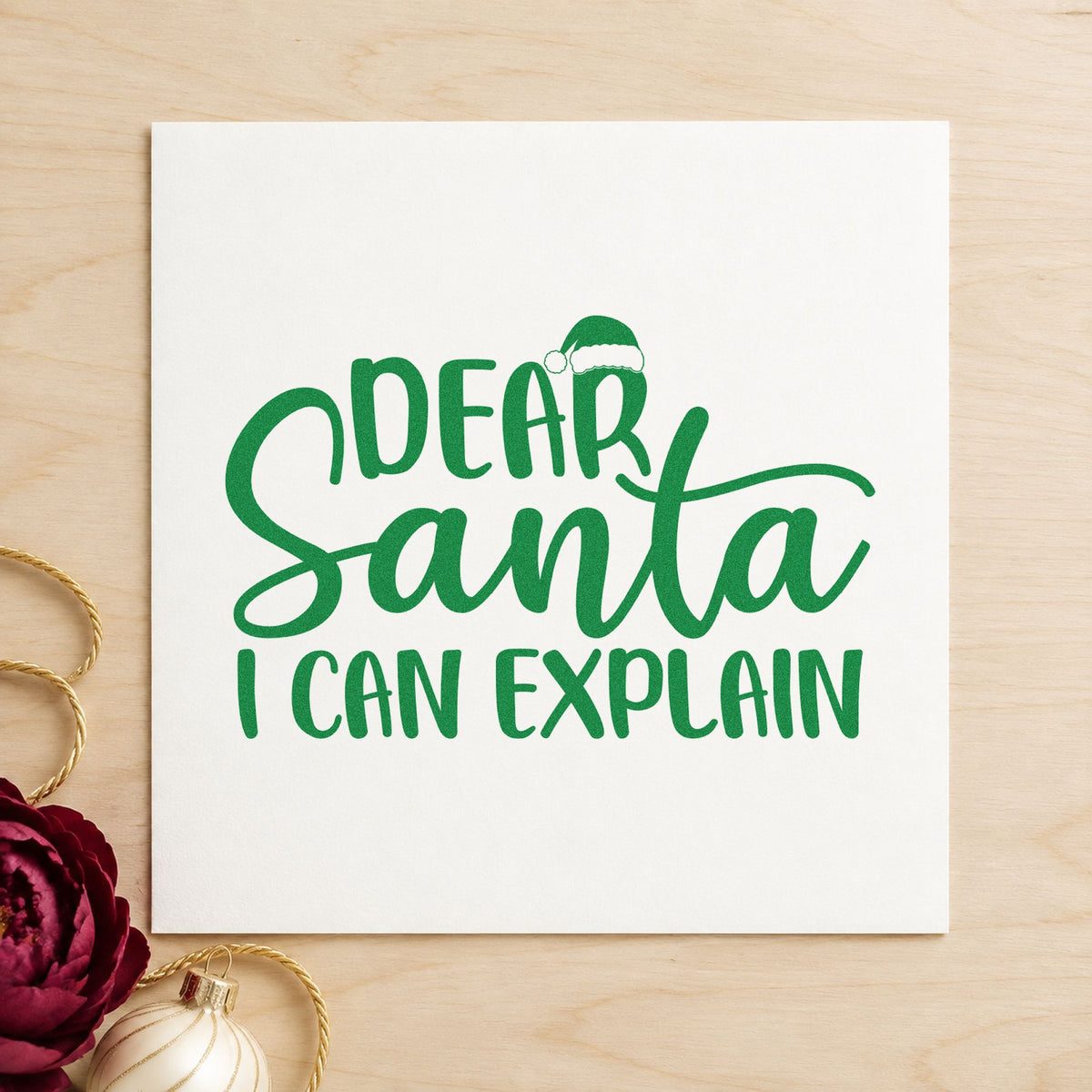 Dear Santa I Can Explain craft stamp imprint in green ink on a handmade project, one idea being break party invites.